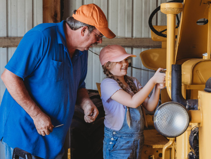 grandfather and child working