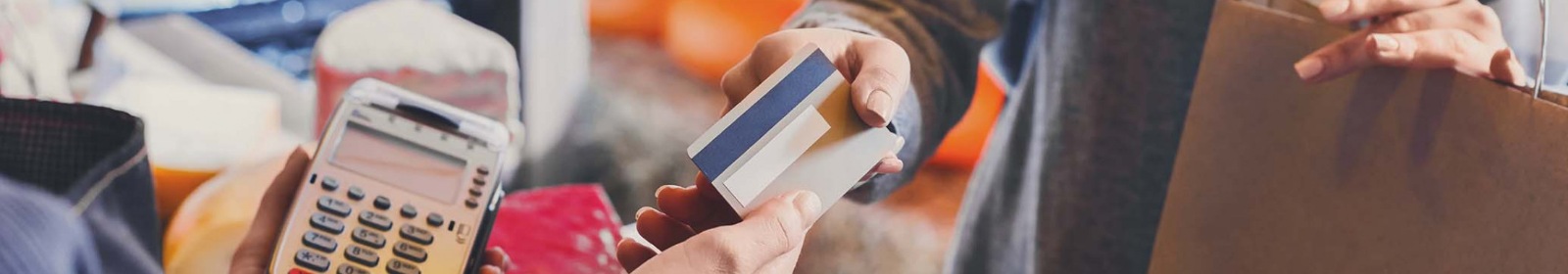 a person paying with a debit/card card